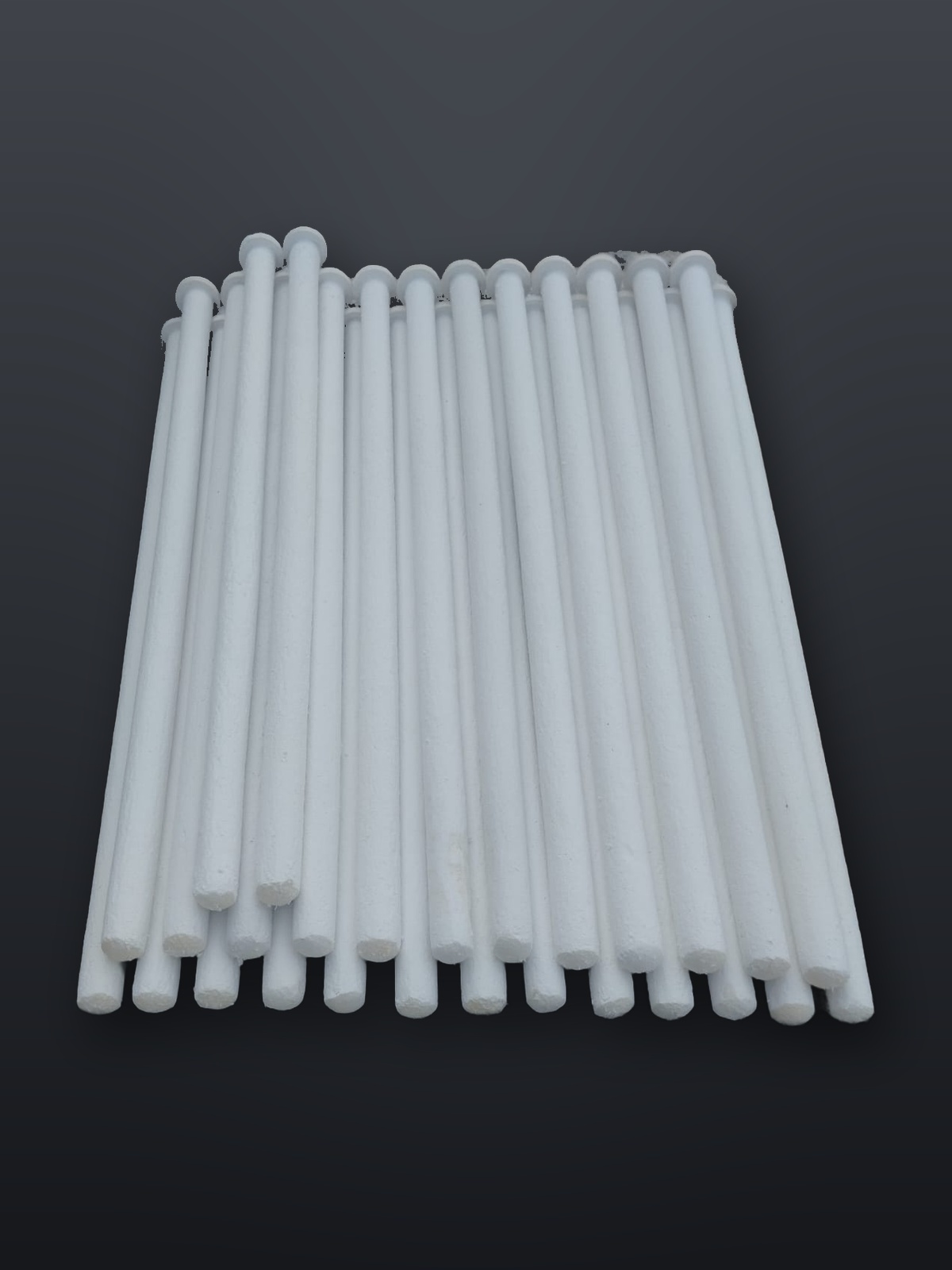 A single ceramic fibre filter candle shown at full length